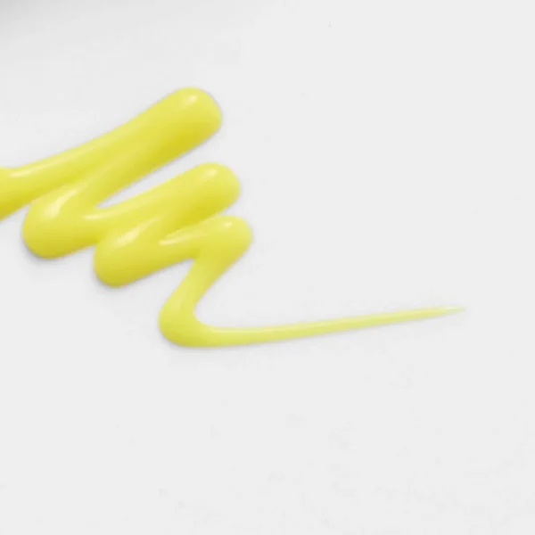 Yellow retinal booster cream texture swatch