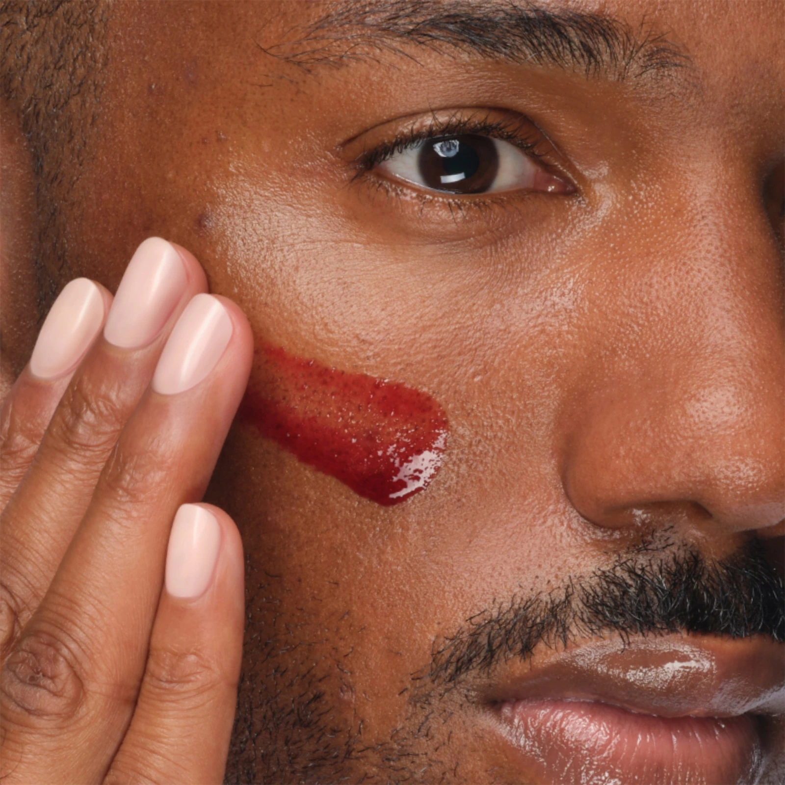 The Ordinary Peeling Solution spread across the cheek during the ten minute wear time
