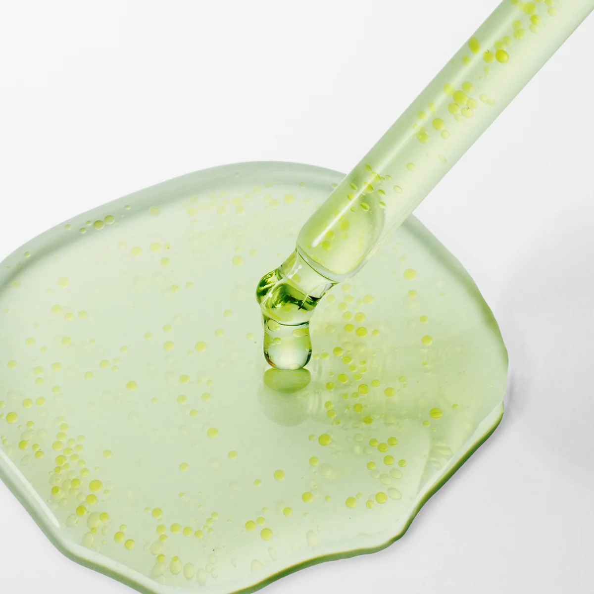 Purito Azelaic Acid 10 Kojic Serum dropper and green serum texture