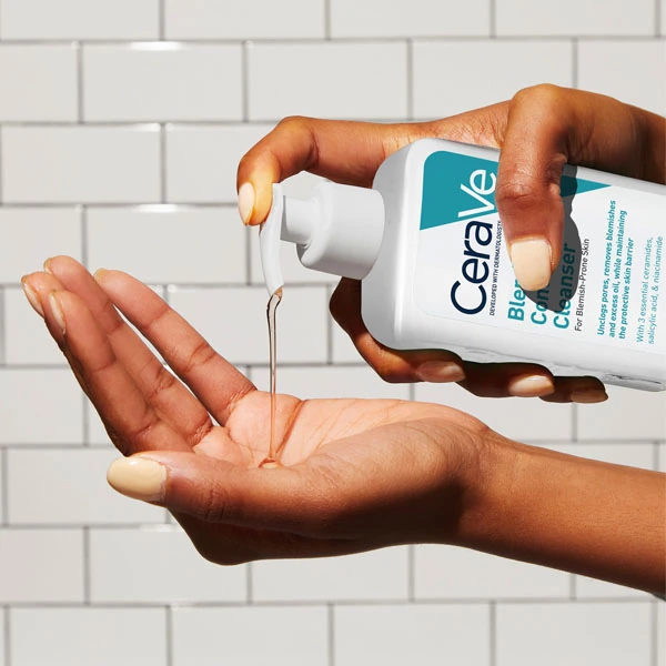 Dispensing CeraVe Blemish Control Cleanser into the palm