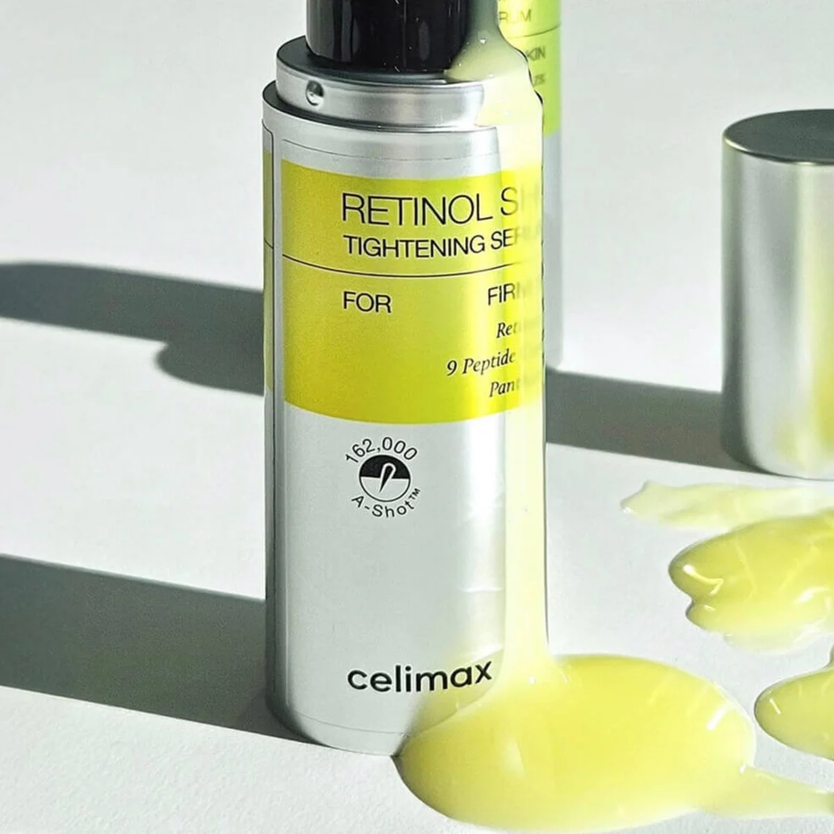 Celimax Retinol Shot Tightening Serum pump bottle with serum drops