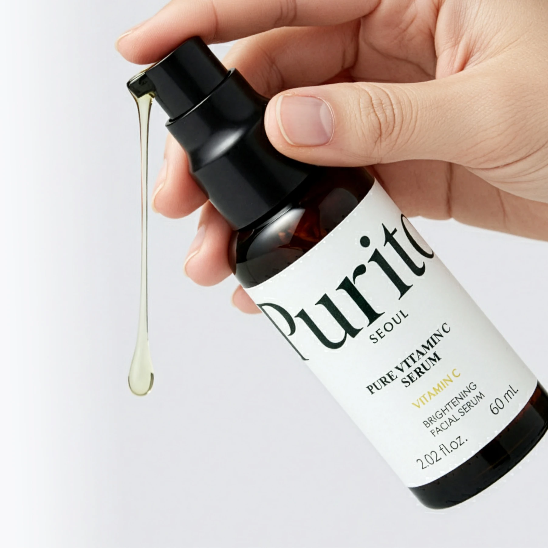 Purito Pure Vitamin C Serum pump in hand